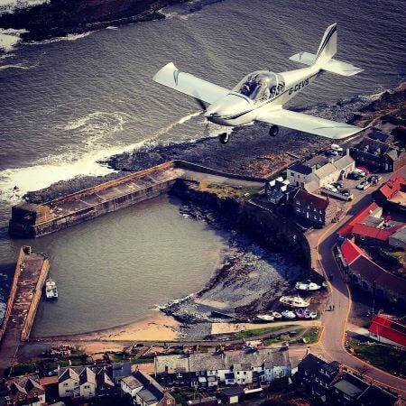 Plane over the harbour