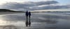 Couple walking on beach 